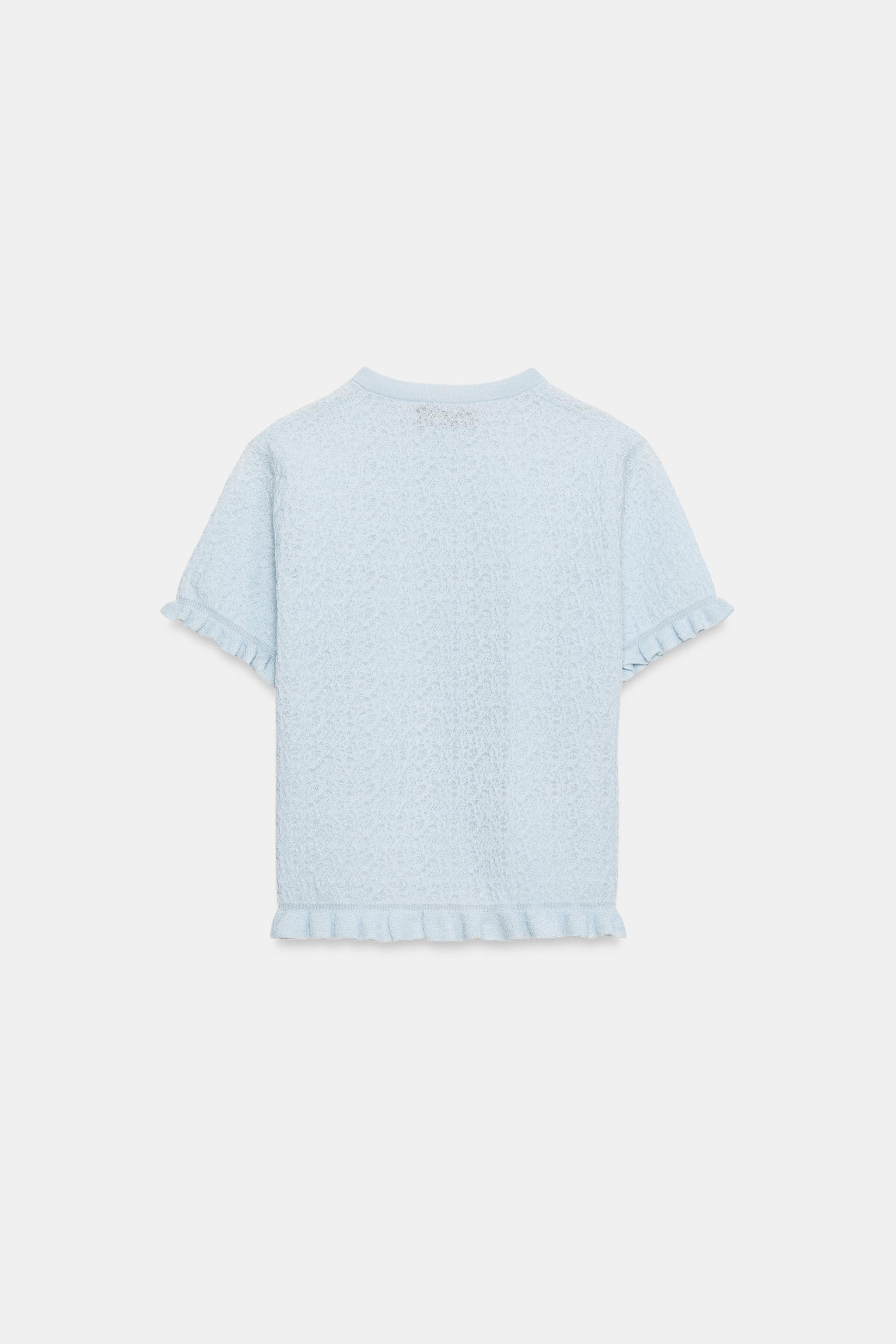 VESTE EN MAILLE STRUCTURÉE À VOLANTS